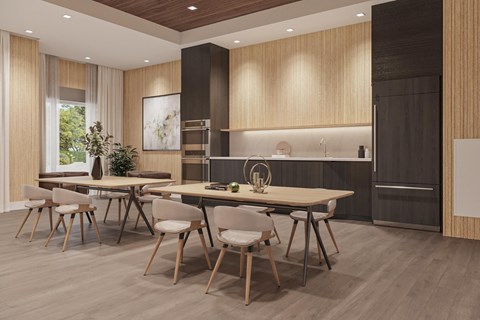 A modern kitchen with a dining table and chairs.
