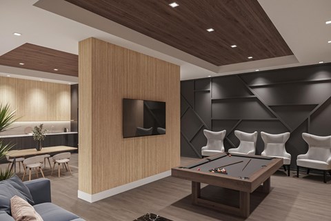 A modern living room with a pool table and a television.