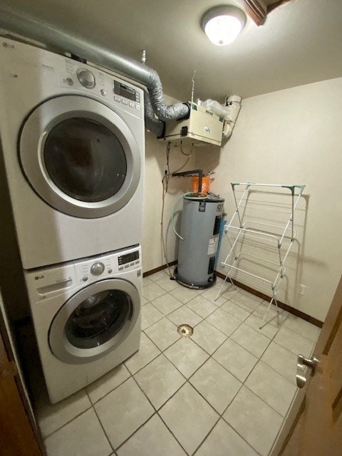 A white dryer and washer are in a small laundry room.