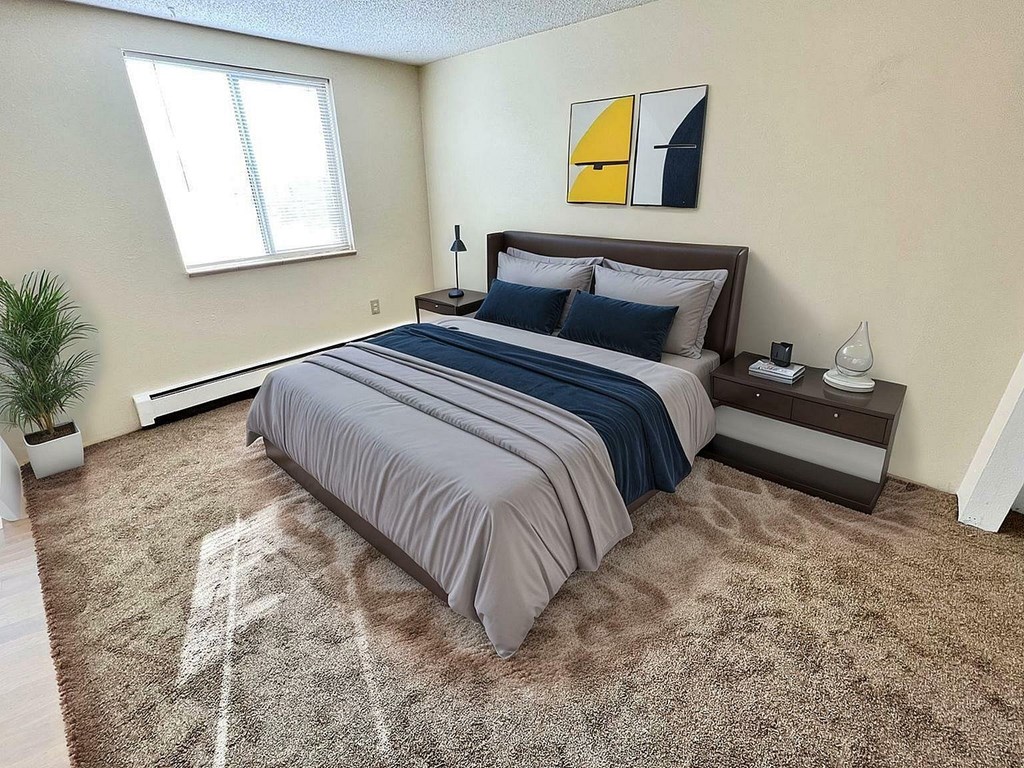 A parking garage with a stone wall on the left side.