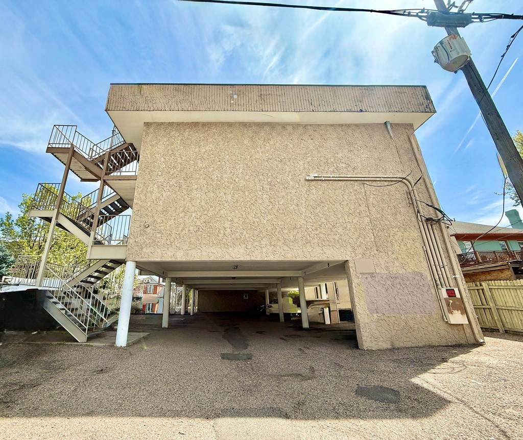A parking garage with cars parked in it.