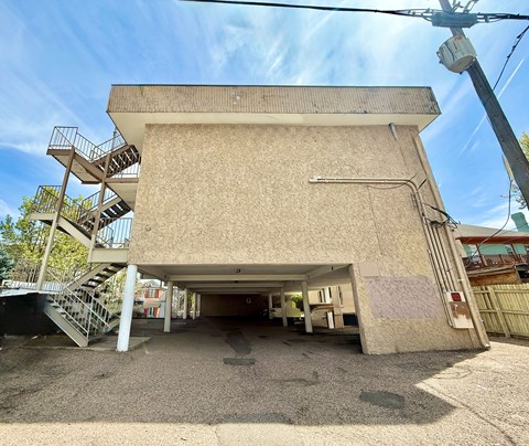 A parking garage with cars parked in it.