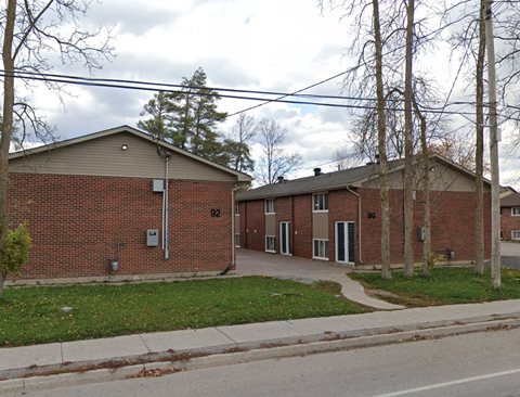 A brick building with the number 92 on it.