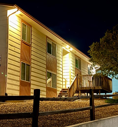 A house with lights on at night.