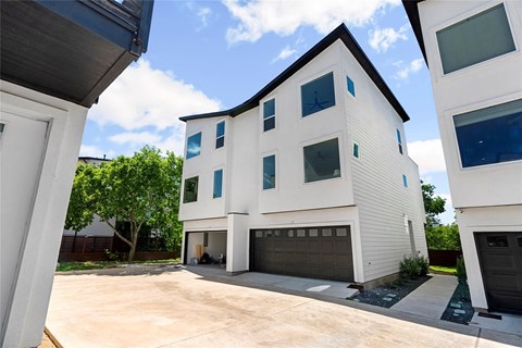 A modern two-story house with a garage.