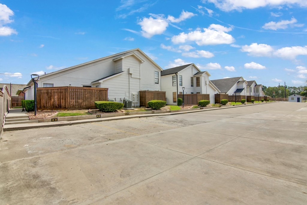 A row of houses with a clear blue sky above them.