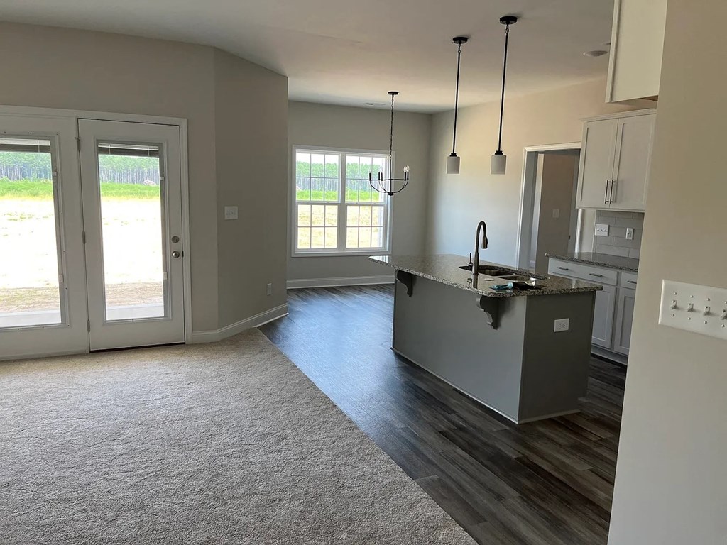 A kitchen with a sink and a window.
