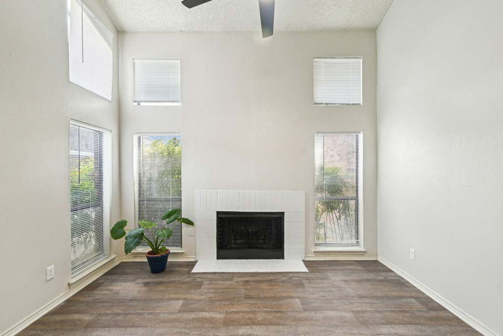 A room with wooden floors and white walls.