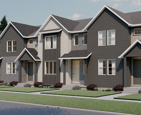 A modern two-story house with a grey exterior and white trim.