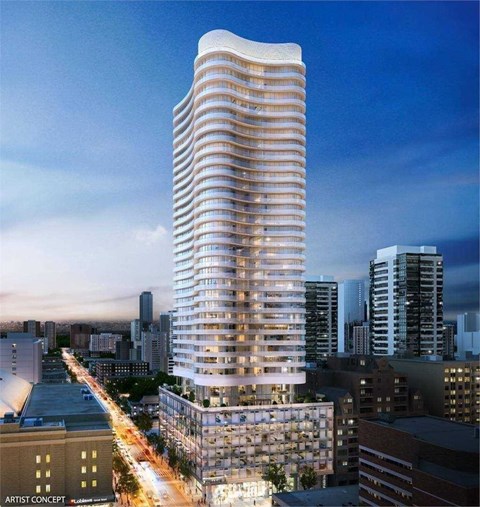 A modern skyscraper with a curved design stands tall among other buildings.