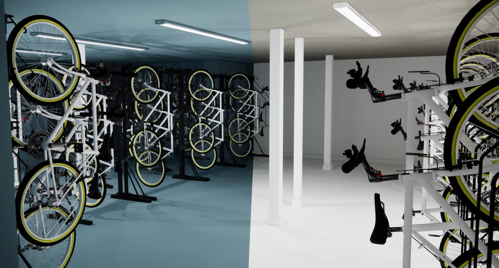 A room with bicycles hanging on racks.