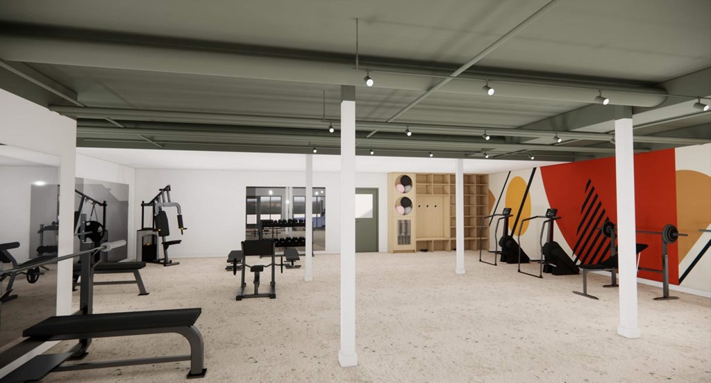 A gym with a variety of equipment including a bench, weights, and a pull up bar.