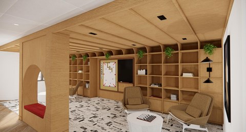 A living room with a patterned carpet and wooden furniture.