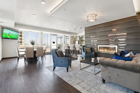 A modern living room with a television and a fireplace.