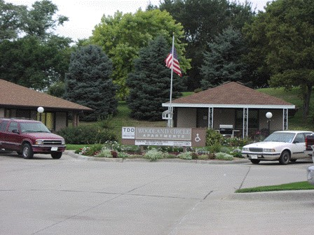 A sign in front of a building that says "TDD Village Circle".