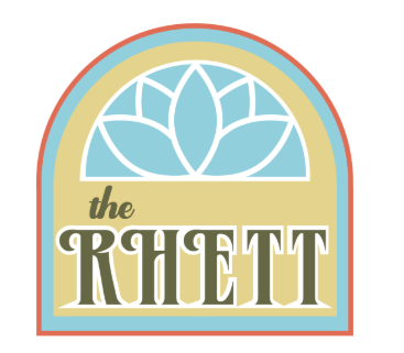 A logo with a flower and the text "the RHETT".