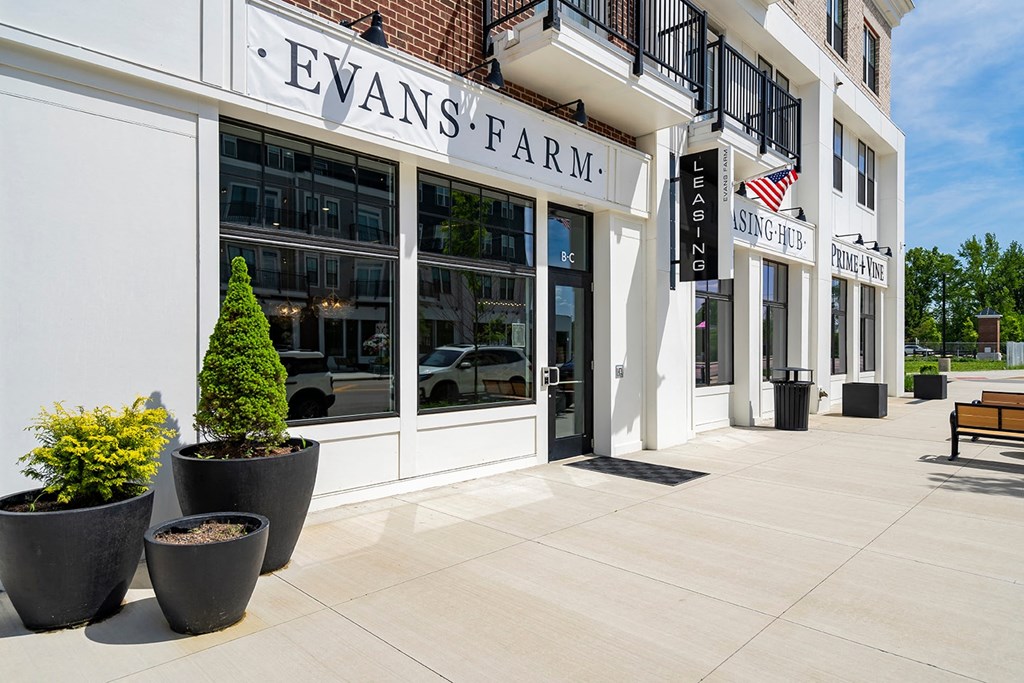 A white building with Evans Farm written on it.