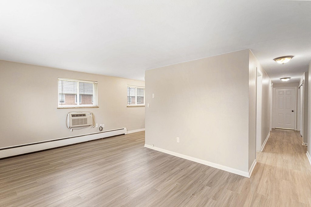 A room with a window and a door.