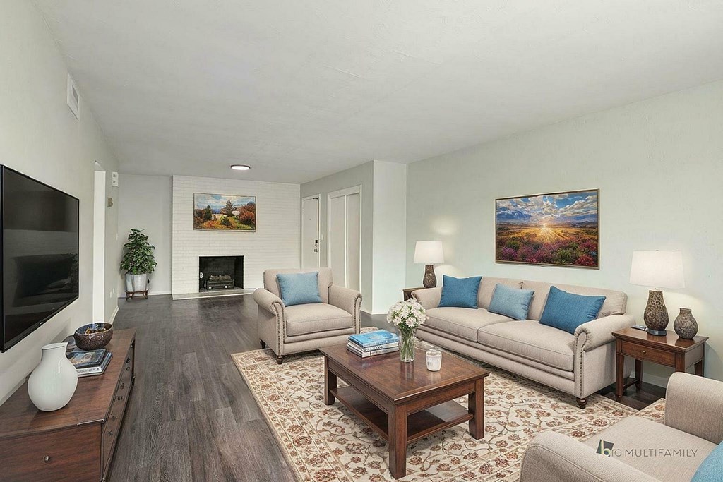 A living room with a couch, chair, and coffee table.