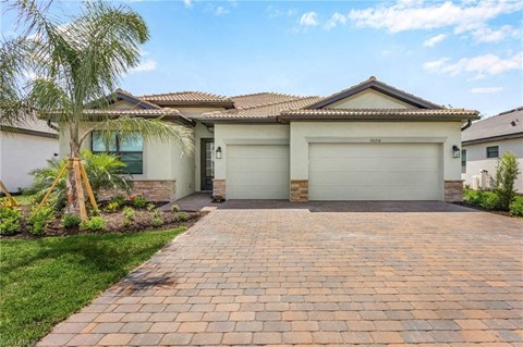 A house with a driveway in front of it.