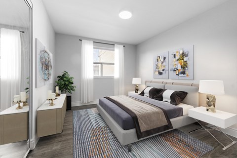 A bedroom with a bed, nightstands, and a rug.