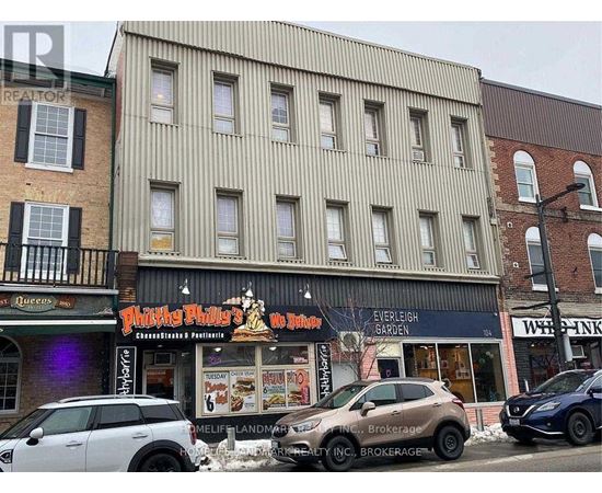 A street view of a building with a sign that says "Philly Phil's".