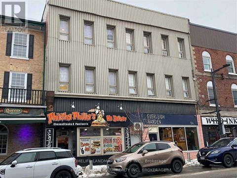 A street view of a building with a sign that says "Philly Phil's".