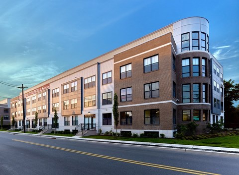 A modern building with a curved top and the name "BENTONVILLE" on the front.