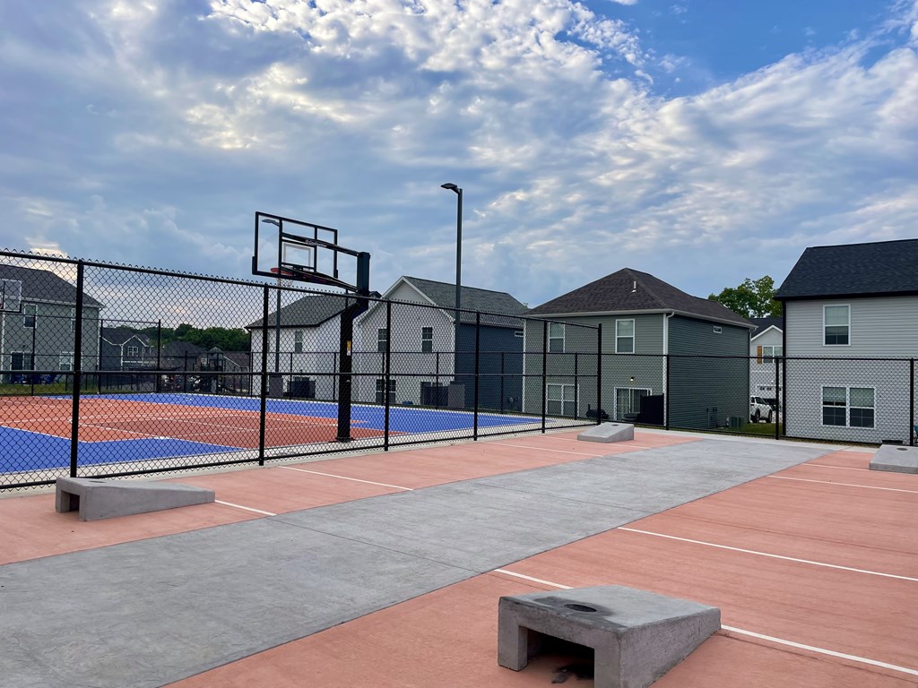 A room with a pool table and a ceiling fan.