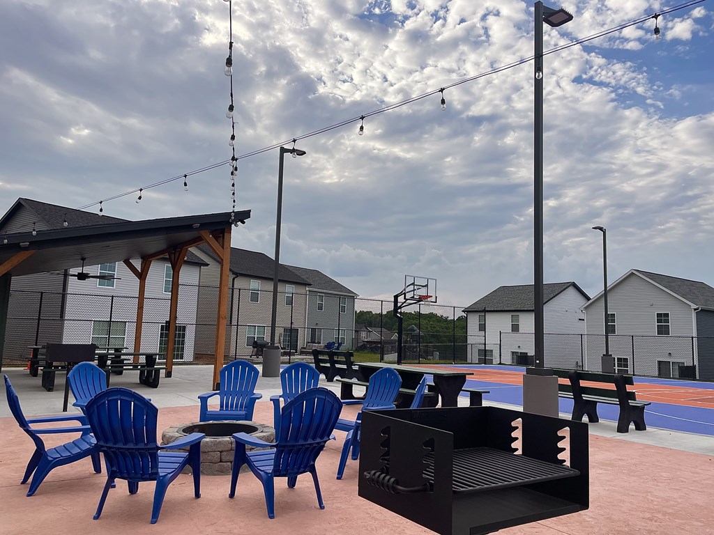 A room with a pool table and a ceiling fan.