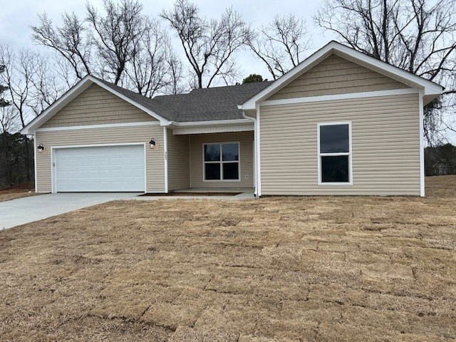 A two-story house with a garage is situated in a field.