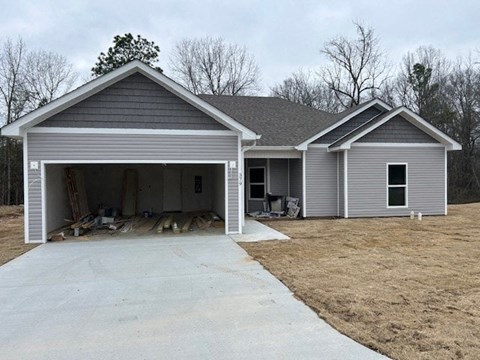 A two-story house with a garage is shown.