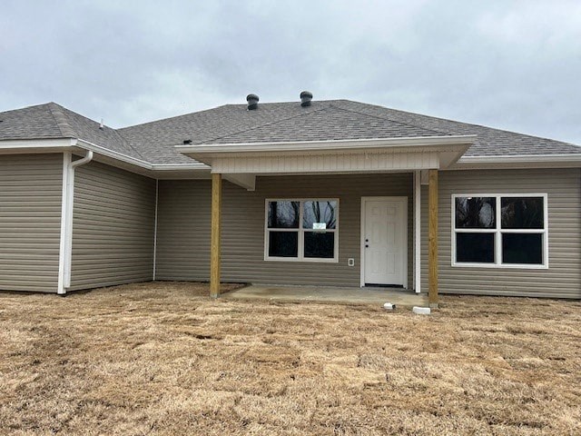 A house with a grey roof and a white door.