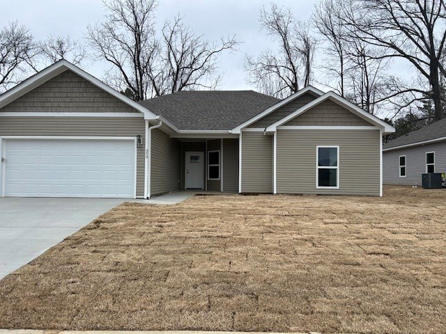 A house with a grey roof and a white garage door.
