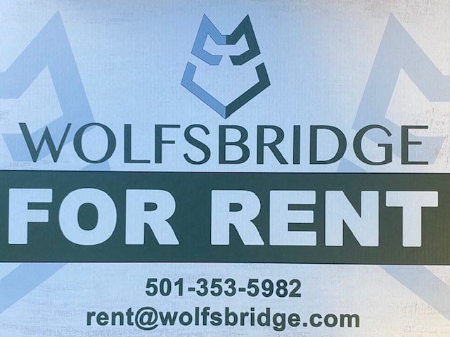 A sign advertising Wolfsbridge for rent with a phone number and email address.