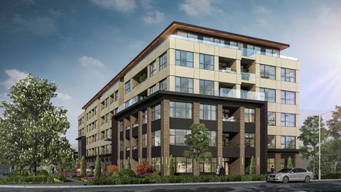 A modern apartment building with balconies and a car parked in front.
