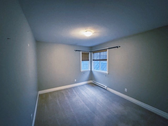 A room with a window and a ceiling light.