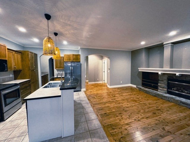 A kitchen with wooden floors and a white island.