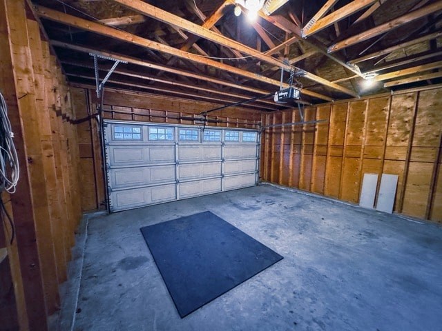 A spacious garage with a black mat on the floor.