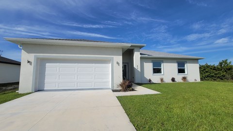 A modern house with a white garage door.