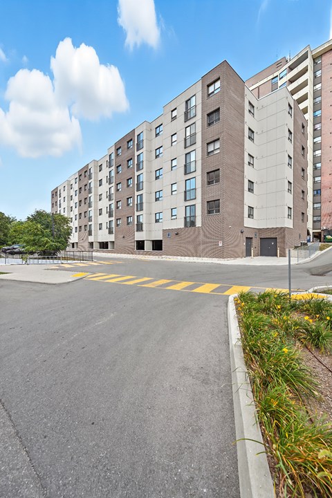 A large building with a parking lot in front of it.