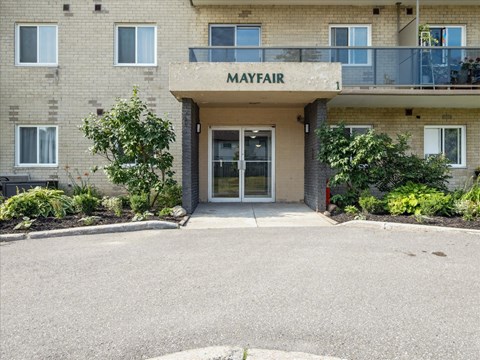 The front of a building with the word "Mayfair" on it.
