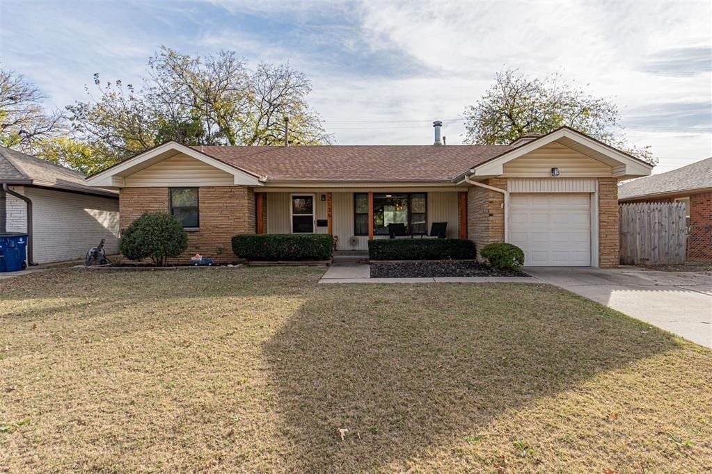 A house with a brown roof and a white garage door.