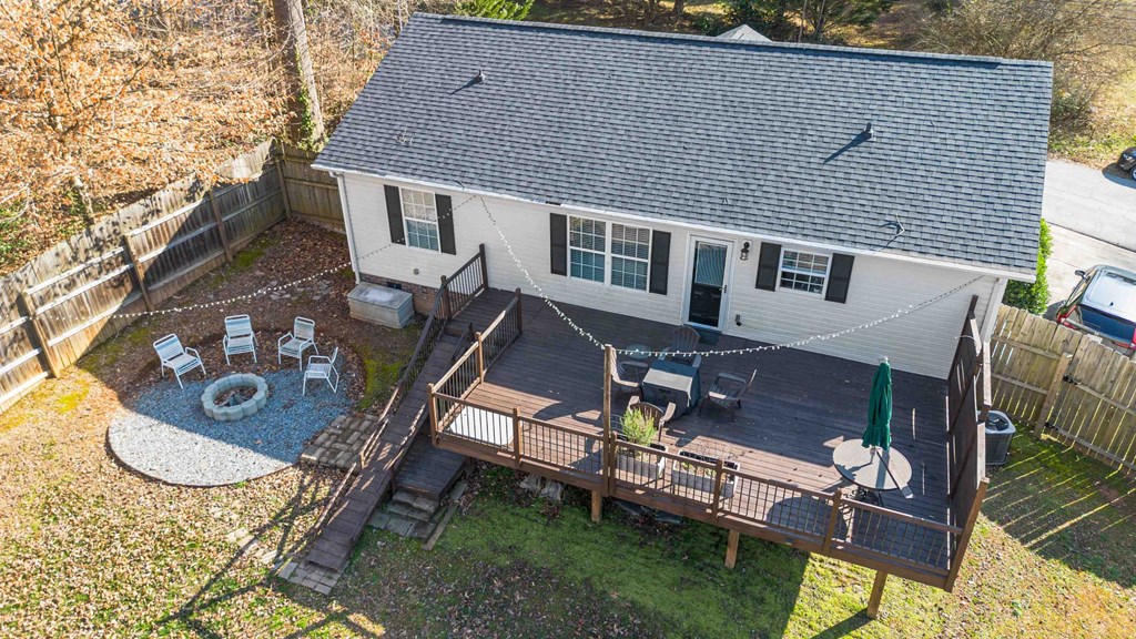 A house with a deck and patio area.