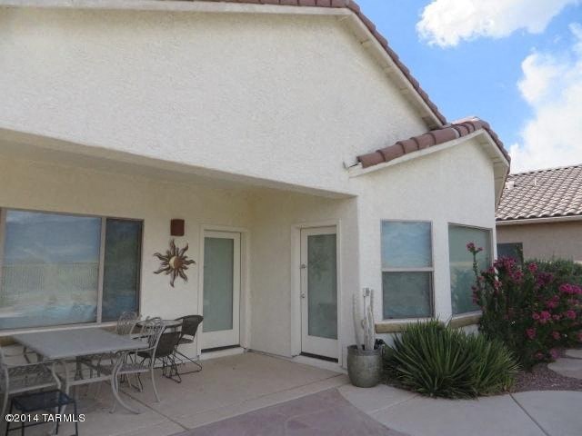 A house with a patio and a table.