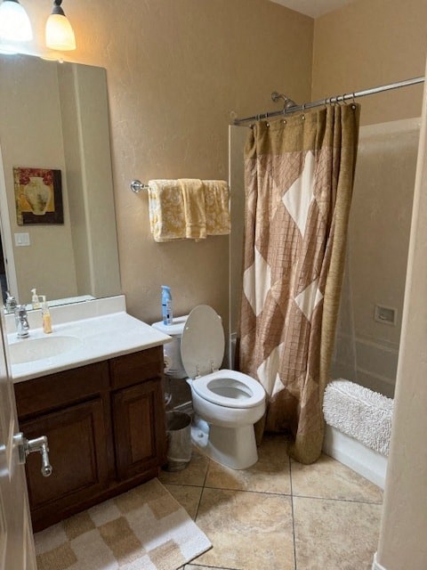 A bathroom with a toilet, sink, and shower curtain.