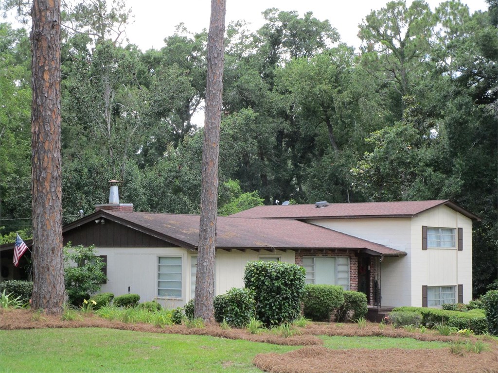 A house with a flag on the front porch.