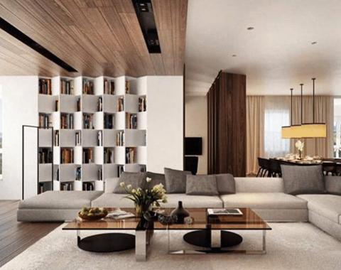 A modern living room with a coffee table in the center.