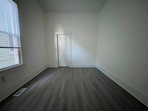 A room with a door and a window.