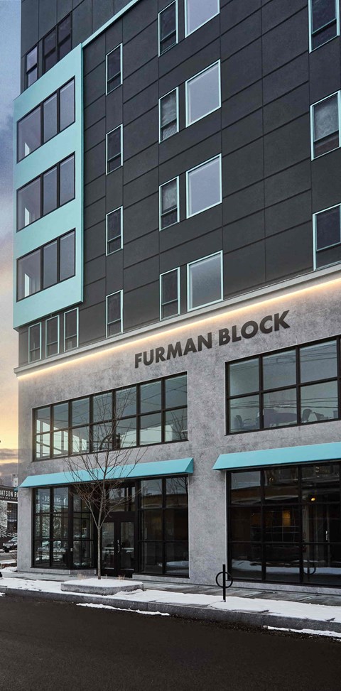 A tall building with the name "FURMAN BLOCK" on it.